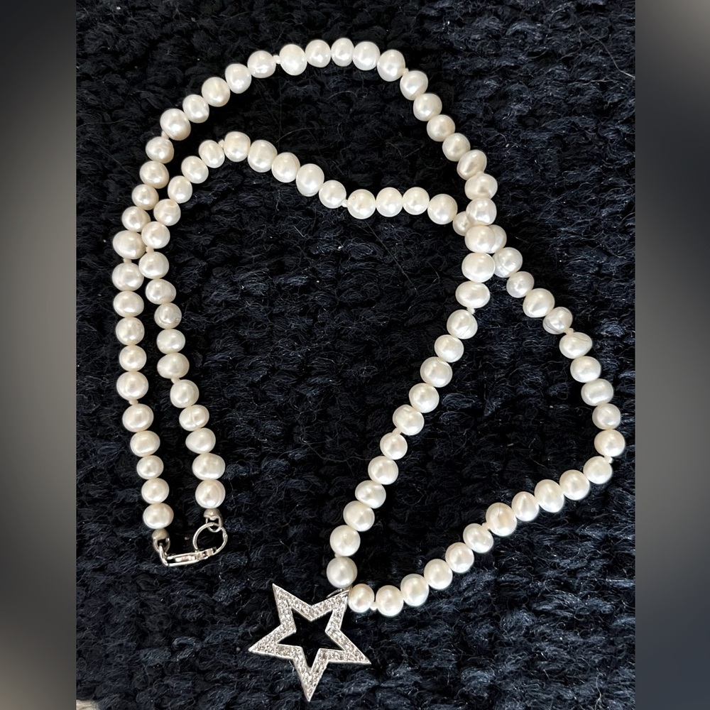 Fresh water pearl necklace. Sterling silver hardware. Star with CZ stones.